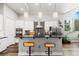 Contemporary kitchen features a breakfast bar with pendant lighting and stainless steel appliances at 6532 S Tempe St, Aurora, CO 80016