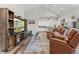 Living room features vaulted ceilings, hardwood floors, entertainment center and open floor plan at 6532 S Tempe St, Aurora, CO 80016