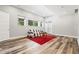 Bright living room with natural light, featuring wood floors, neutral tones, and a cozy seating area at 6532 S Tempe St, Aurora, CO 80016