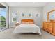Neutral main bedroom with carpet, walkout balcony and dresser at 6532 S Tempe St, Aurora, CO 80016