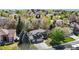 Beautiful aerial view of the property showcasing lush landscaping, a well-maintained yard, and mature trees surrounding the home at 540 Columbine Ave, Broomfield, CO 80020