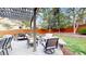 Backyard patio featuring seating and a garden with privacy fence views at 540 Columbine Ave, Broomfield, CO 80020