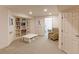 Neutral finished basement includes built-in shelving, storage and bright lighting at 540 Columbine Ave, Broomfield, CO 80020