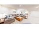 A fully finished basement featuring a spacious seating area at 540 Columbine Ave, Broomfield, CO 80020