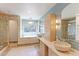Bathroom with stone finishes, dual vessel sinks, and a glass-enclosed shower at 540 Columbine Ave, Broomfield, CO 80020