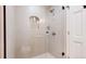 A modern bathroom featuring a glass-enclosed shower with tiled walls and a built-in shower niche at 540 Columbine Ave, Broomfield, CO 80020