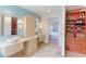 Bathroom featuring dual vessel sinks, natural light, and custom cabinetry at 540 Columbine Ave, Broomfield, CO 80020