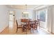 Elegant dining room with hardwood floors, a chandelier, and a view of the backyard at 540 Columbine Ave, Broomfield, CO 80020