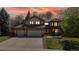 Beautiful home exterior with a well-maintained lawn, brick accents, and warm inviting lighting at 540 Columbine Ave, Broomfield, CO 80020