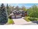 Charming two-story home features a spacious driveway, well-manicured lawn, and beautiful landscaping at 540 Columbine Ave, Broomfield, CO 80020