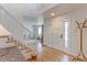 Inviting foyer with hardwood floors, a white staircase, and a front door with glass panels at 540 Columbine Ave, Broomfield, CO 80020