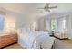 Main bedroom with carpet, a ceiling fan, natural light, and reading chairs at 540 Columbine Ave, Broomfield, CO 80020