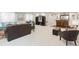 Spacious finished basement with comfortable seating areas, a bar, and plenty of room for entertaining at 25049 E Alder Dr, Aurora, CO 80016