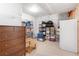 Unfinished basement area offers potential with storage, organization and additional chest freezer at 25049 E Alder Dr, Aurora, CO 80016