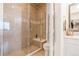 Beautiful bathroom featuring a tiled shower with a glass door and a heated towel rack at 25049 E Alder Dr, Aurora, CO 80016