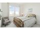 Bright bedroom featuring a large window with scenic views, neutral walls and comfortable chair at 25049 E Alder Dr, Aurora, CO 80016