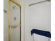 Bathroom featuring a shower stall with gold trim and a showerhead at 2826 S Lansing Way, Aurora, CO 80014