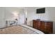 Bedroom featuring a desk, dresser and television at 2826 S Lansing Way, Aurora, CO 80014