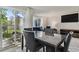 Bright dining room with modern furniture and a view to the living room at 2826 S Lansing Way, Aurora, CO 80014