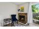 Cozy fireplace with decorative mantel, chair, and artwork, creating a warm ambiance at 2826 S Lansing Way, Aurora, CO 80014