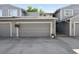 Exterior view of the property showing a well-maintained garage and curb appeal at 2826 S Lansing Way, Aurora, CO 80014