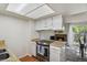 Bright kitchen featuring modern appliances and a cozy breakfast nook with a fireplace at 2826 S Lansing Way, Aurora, CO 80014