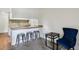 The open kitchen is bright and features barstool seating and natural light at 2826 S Lansing Way, Aurora, CO 80014