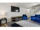 Stylish living area featuring a modern entertainment center and comfortable seating arrangement at 2826 S Lansing Way, Aurora, CO 80014