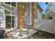 The outdoor patio area has a brick fireplace, with a door leading to the home's interior, and outdoor seating at 2826 S Lansing Way, Aurora, CO 80014