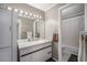 Bathroom featuring modern vanity with clean, white countertops and stylish lighting at 10115 W 25Th Ave # 1, Lakewood, CO 80215