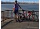 Pictured is a Personal with bike by the lake with mountains in the background at 10115 W 25Th Ave # 1, Lakewood, CO 80215