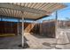 Assigned parking space under carport area with limited fencing and some tree cover at 10115 W 25Th Ave # 1, Lakewood, CO 80215