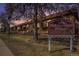 Exterior view of Paramount Heights condominiums featuring well-maintained landscaping and signage at 10115 W 25Th Ave # 1, Lakewood, CO 80215
