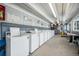 Bright on-site laundry room featuring multiple washing machines for resident convenience at 10115 W 25Th Ave # 1, Lakewood, CO 80215