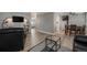 Open living room layout with modern furnishings and wood-style flooring at 10115 W 25Th Ave # 1, Lakewood, CO 80215