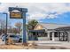 Inviting restaurant exterior with rustic wood accents and a metal roof, offering a welcoming dining atmosphere at 10115 W 25Th Ave # 1, Lakewood, CO 80215