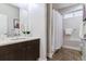 Clean bathroom with a shower/tub combo and modern vanity at 3444 Mariposa St, Denver, CO 80211