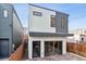 Modern home exterior with sliding glass doors and a patio at 3444 Mariposa St, Denver, CO 80211