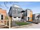 Modern architectural home with gray siding and a small front yard at 3444 Mariposa St, Denver, CO 80211