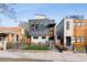 Modern home with gray siding, a fenced yard, and a sleek design at 3444 Mariposa St, Denver, CO 80211