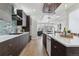 Open concept kitchen with dark cabinetry, white countertops, and stainless steel appliances at 3444 Mariposa St, Denver, CO 80211