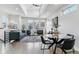 Open concept living and dining space with high ceilings and a modern chandelier at 3444 Mariposa St, Denver, CO 80211