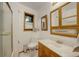 Clean bathroom with wood vanity and shower/tub combo at 20958 Taos Rd, Indian Hills, CO 80454