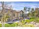 Well-manicured backyard featuring a sunroom, lush garden beds, and a serene outdoor space at 3419 Traver Dr, Broomfield, CO 80023