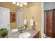Bathroom featuring double sinks, large mirror, and vanity at 3419 Traver Dr, Broomfield, CO 80023