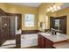 Bathroom with dual sink vanity, shower, separate tub and tiled walls at 3419 Traver Dr, Broomfield, CO 80023