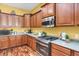 Close up view of kitchen with stainless steel oven and cooktop at 3419 Traver Dr, Broomfield, CO 80023