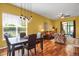 Cozy living room featuring hardwood floors, chandelier and lots of natural light at 3419 Traver Dr, Broomfield, CO 80023