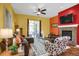 Comfortable living room featuring a fireplace and access to an outdoor sunroom at 3419 Traver Dr, Broomfield, CO 80023
