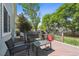 Relaxing back deck with stylish outdoor seating and a grill, perfect for entertaining guests at 5229 Nighthawk Pkwy, Brighton, CO 80601